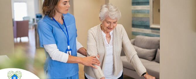 A professional caregiver helps an older client with a walker get around.